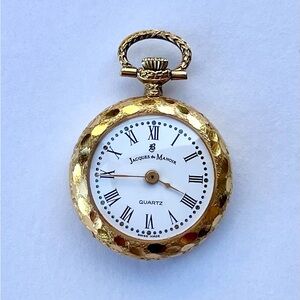VINTAGE JACQUES DU MANOIR SWISS CARVED GOLD TONE PENDANT WATCH